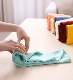 a hand folding clothes